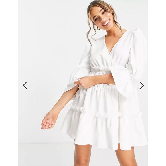 In The Style x Billie Faiers wrap over flutter sleeve tiered mini dress in white - Picture 2 of 7